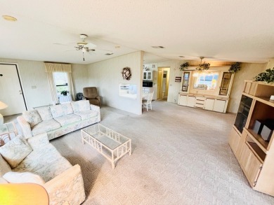 Welcome to this beautiful 2-bedroom, 2-bathroom home nestled in on Pine Lakes Country Club in Florida - for sale on GolfHomes.com, golf home, golf lot
