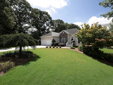 Very attractive, Great curb appeal, lovely landscaping is your on Creekside Golf and Country Club in Georgia - for sale on GolfHomes.com, golf home, golf lot