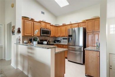 Feel the spaciousness created by the vaulted ceilings, generous on The American Golf Club in Florida - for sale on GolfHomes.com, golf home, golf lot