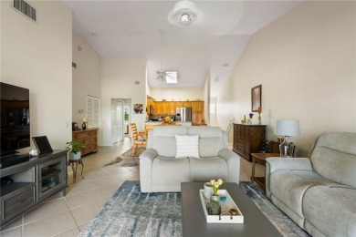 Feel the spaciousness created by the vaulted ceilings, generous on The American Golf Club in Florida - for sale on GolfHomes.com, golf home, golf lot