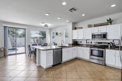 Inviting single-story with 3 beds, 2 baths, open kitchen with on Seville Golf and Country Club in Arizona - for sale on GolfHomes.com, golf home, golf lot