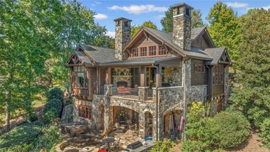 Breathtaking views of Lake Keowee's only waterfall frame this on The Cliffs At Keowee Falls in South Carolina - for sale on GolfHomes.com, golf home, golf lot