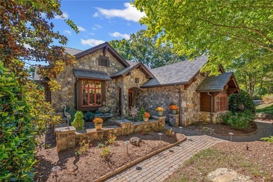 Breathtaking views of Lake Keowee's only waterfall frame this on The Cliffs At Keowee Falls in South Carolina - for sale on GolfHomes.com, golf home, golf lot