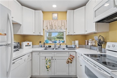 A rare gem! This 1st-floor end-unit sits in a unique Non-55+ on The American Golf Club in Florida - for sale on GolfHomes.com, golf home, golf lot