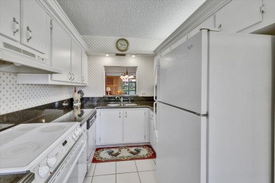 DON'T WAIT FOR THE BEST PRICED CONDO TO SELL! Fabulous, light on Boca Dunes Golf and Country Club in Florida - for sale on GolfHomes.com, golf home, golf lot