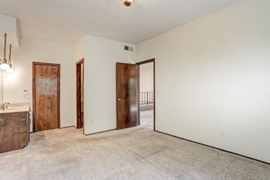 This lovely townhome in sought after Chimney Ridge sits directly on Arroyo Del Oso Golf Course in New Mexico - for sale on GolfHomes.com, golf home, golf lot