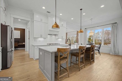 Welcome to a home that truly raises the bar in Traditions of on Traditions of Braselton Golf Club in Georgia - for sale on GolfHomes.com, golf home, golf lot