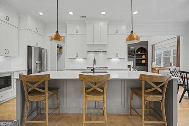 Welcome to a home that truly raises the bar in Traditions of on Traditions of Braselton Golf Club in Georgia - for sale on GolfHomes.com, golf home, golf lot