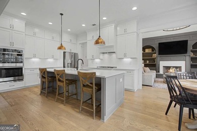 Welcome to a home that truly raises the bar in Traditions of on Traditions of Braselton Golf Club in Georgia - for sale on GolfHomes.com, golf home, golf lot