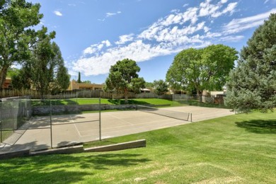 This lovely townhome in sought after Chimney Ridge sits directly on Arroyo Del Oso Golf Course in New Mexico - for sale on GolfHomes.com, golf home, golf lot