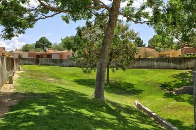 This lovely townhome in sought after Chimney Ridge sits directly on Arroyo Del Oso Golf Course in New Mexico - for sale on GolfHomes.com, golf home, golf lot