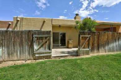 This lovely townhome in sought after Chimney Ridge sits directly on Arroyo Del Oso Golf Course in New Mexico - for sale on GolfHomes.com, golf home, golf lot