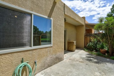 This lovely townhome in sought after Chimney Ridge sits directly on Arroyo Del Oso Golf Course in New Mexico - for sale on GolfHomes.com, golf home, golf lot