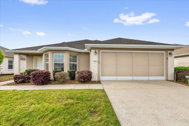 Welcome to this beautifully maintained Challedon model home in on Eagle Ridge At Spruce Creek Country Club in Florida - for sale on GolfHomes.com, golf home, golf lot