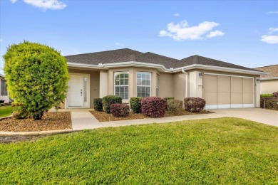Welcome to this beautifully maintained Challedon model home in on Eagle Ridge At Spruce Creek Country Club in Florida - for sale on GolfHomes.com, golf home, golf lot