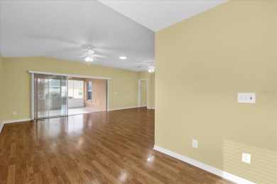 Welcome to this beautifully maintained Challedon model home in on Eagle Ridge At Spruce Creek Country Club in Florida - for sale on GolfHomes.com, golf home, golf lot