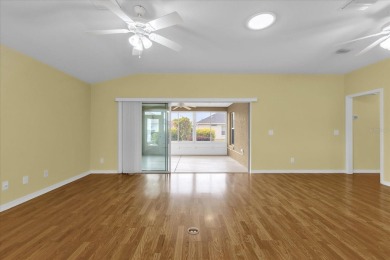 Welcome to this beautifully maintained Challedon model home in on Eagle Ridge At Spruce Creek Country Club in Florida - for sale on GolfHomes.com, golf home, golf lot