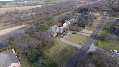 Discover one of the last remaining RIVERFRONT lots in the highly on Pecan Plantation Country Club in Texas - for sale on GolfHomes.com, golf home, golf lot