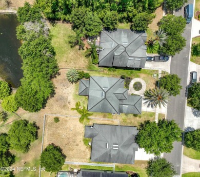 Prior model home featuring a finished air-conditioned garage and on St. Johns Golf and Country Club in Florida - for sale on GolfHomes.com, golf home, golf lot