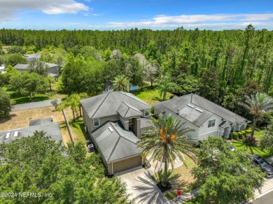 Prior model home featuring a finished air-conditioned garage and on St. Johns Golf and Country Club in Florida - for sale on GolfHomes.com, golf home, golf lot