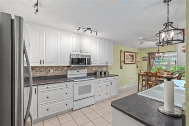 Welcome to this beautifully updated Turnberry Extended model on Royal Oaks Golf Club in Florida - for sale on GolfHomes.com, golf home, golf lot