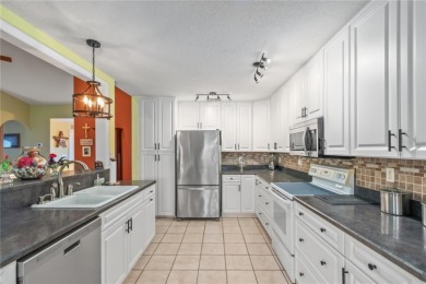 Welcome to this beautifully updated Turnberry Extended model on Royal Oaks Golf Club in Florida - for sale on GolfHomes.com, golf home, golf lot