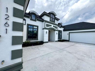 Welcome to 1261 Wood Stork Dr., a stunning new construction on Wild Wing Plantation in South Carolina - for sale on GolfHomes.com, golf home, golf lot