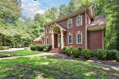 This classic brick Colonial offers enduring appeal paired with a on Fords Colony Country Club in Virginia - for sale on GolfHomes.com, golf home, golf lot