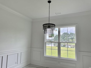 Welcome to 1261 Wood Stork Dr., a stunning new construction on Wild Wing Plantation in South Carolina - for sale on GolfHomes.com, golf home, golf lot