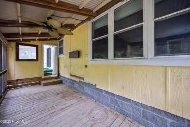 Welcome to this charming 3-bedroom, 2-bathroom home offering 1 on Harbour Point Golf Club in North Carolina - for sale on GolfHomes.com, golf home, golf lot