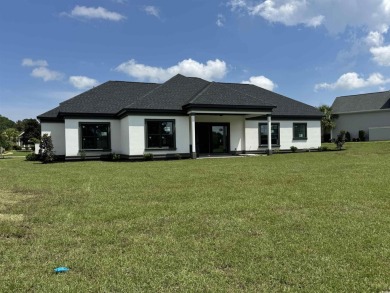 Welcome to 1261 Wood Stork Dr., a stunning new construction on Wild Wing Plantation in South Carolina - for sale on GolfHomes.com, golf home, golf lot