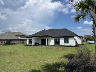 Welcome to 1261 Wood Stork Dr., a stunning new construction on Wild Wing Plantation in South Carolina - for sale on GolfHomes.com, golf home, golf lot