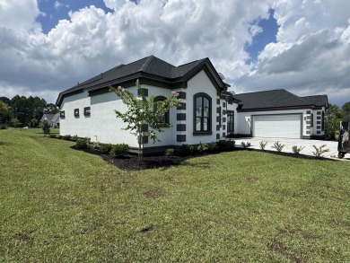 Welcome to 1261 Wood Stork Dr., a stunning new construction on Wild Wing Plantation in South Carolina - for sale on GolfHomes.com, golf home, golf lot