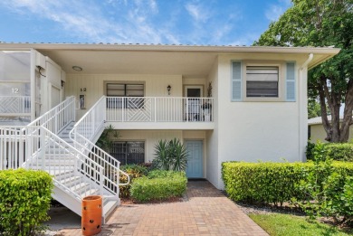 Enjoy serene water views from this light and bright first-floor on Hunters Run Golf and Country Club in Florida - for sale on GolfHomes.com, golf home, golf lot