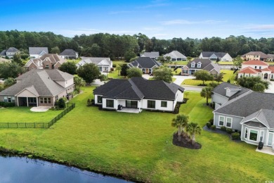 Welcome to 1261 Wood Stork Dr., a stunning new construction on Wild Wing Plantation in South Carolina - for sale on GolfHomes.com, golf home, golf lot