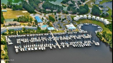 Welcome to this charming 3-bedroom, 2-bathroom home offering 1 on Harbour Point Golf Club in North Carolina - for sale on GolfHomes.com, golf home, golf lot