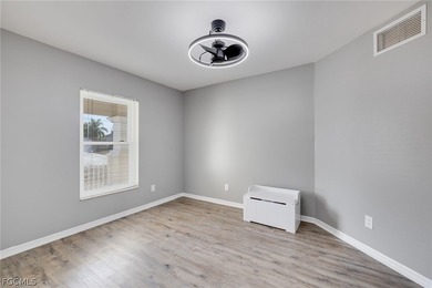 Beautifully updated 3-bedroom plus den, 2-bath home in SW Cape on Palmetto-Pine Country Club in Florida - for sale on GolfHomes.com, golf home, golf lot