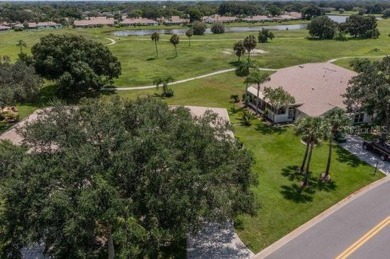 This gorgeous home has it all!  Check out the curb appeal of the on Falcon Watch Golf Club in Florida - for sale on GolfHomes.com, golf home, golf lot