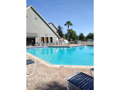 You don't want to miss this lovely 2-bedroom/1.5-bath home in on Lake Henry Golf Club in Florida - for sale on GolfHomes.com, golf home, golf lot