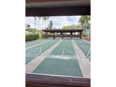 You don't want to miss this lovely 2-bedroom/1.5-bath home in on Lake Henry Golf Club in Florida - for sale on GolfHomes.com, golf home, golf lot