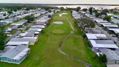 You don't want to miss this lovely 2-bedroom/1.5-bath home in on Lake Henry Golf Club in Florida - for sale on GolfHomes.com, golf home, golf lot