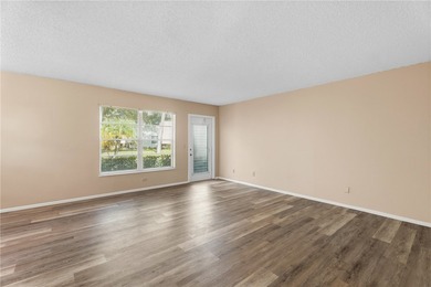 Desirable first floor 2-bedroom, 2-bath in an active 55+ on The American Golf Club in Florida - for sale on GolfHomes.com, golf home, golf lot