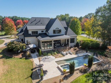 Experience luxury resort-style living in The Point! Surrounded on Trump National Golf Club Charlotte in North Carolina - for sale on GolfHomes.com, golf home, golf lot