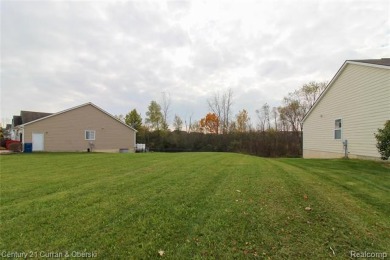 Build your dream home on this large 70 x 122 ft lot in newer on Green Oaks Golf Course in Michigan - for sale on GolfHomes.com, golf home, golf lot