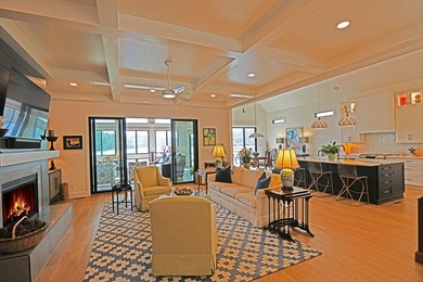 Where Lakefront Luxury Meets Timeless Design.  524 Grand Harbor on The Patriot Golf Club At Grand Harbor in South Carolina - for sale on GolfHomes.com, golf home, golf lot