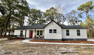 This beautifully remodeled home is truly move-in ready, offering on Wildwood Country Club in Florida - for sale on GolfHomes.com, golf home, golf lot