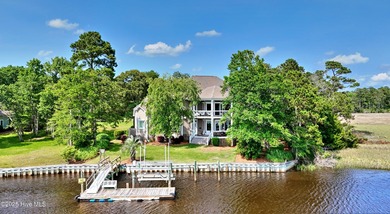 Welcome to this exquisite riverfront property, located in a golf on Carolina National Golf Club in North Carolina - for sale on GolfHomes.com, golf home, golf lot