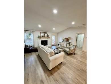 This beautifully remodeled home is truly move-in ready, offering on Wildwood Country Club in Florida - for sale on GolfHomes.com, golf home, golf lot