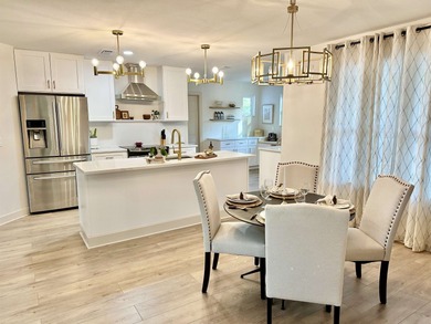 This beautifully remodeled home is truly move-in ready, offering on Wildwood Country Club in Florida - for sale on GolfHomes.com, golf home, golf lot