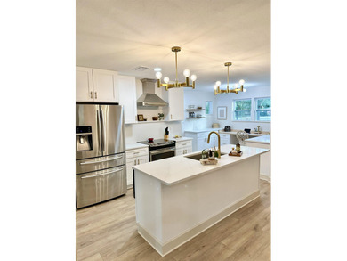 This beautifully remodeled home is truly move-in ready, offering on Wildwood Country Club in Florida - for sale on GolfHomes.com, golf home, golf lot